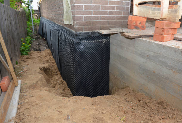 Happy homeowners after waterproofing job in Universal
